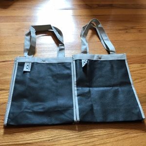 Two small reusable Oakley bags